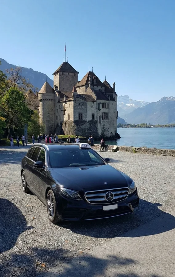 Black Mercedes taxi parked at Chillon castle
